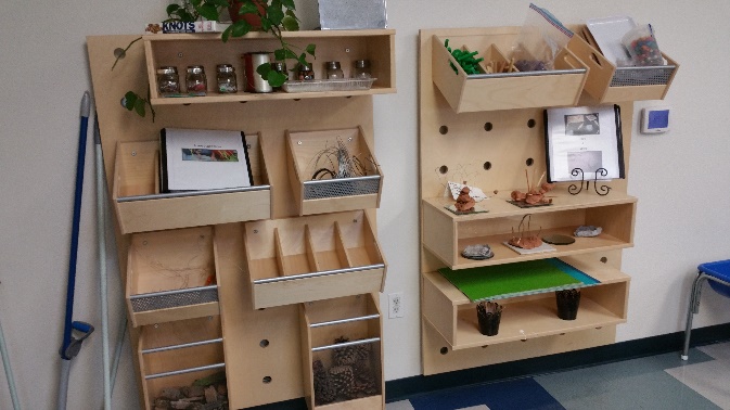 These shelves are in a classroom for 3-year-olds. What adjustments might need to be made to meet the needs of the children and keep them safe?