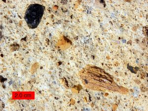Tuff showing various size fragments of minerals and ash blown out of a volcano