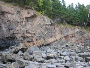 Igneous sill intruding in between Paleozoic strata in Nova Scotia