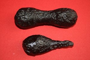 Shatter cones are cone-shaped features, that show lines that converge to cone shapes.