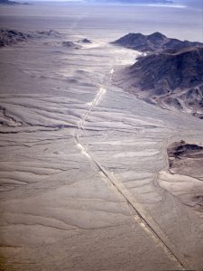 Source: Image from USGS Aerial photo of mountain remnants surrounded by their own erosional debris.