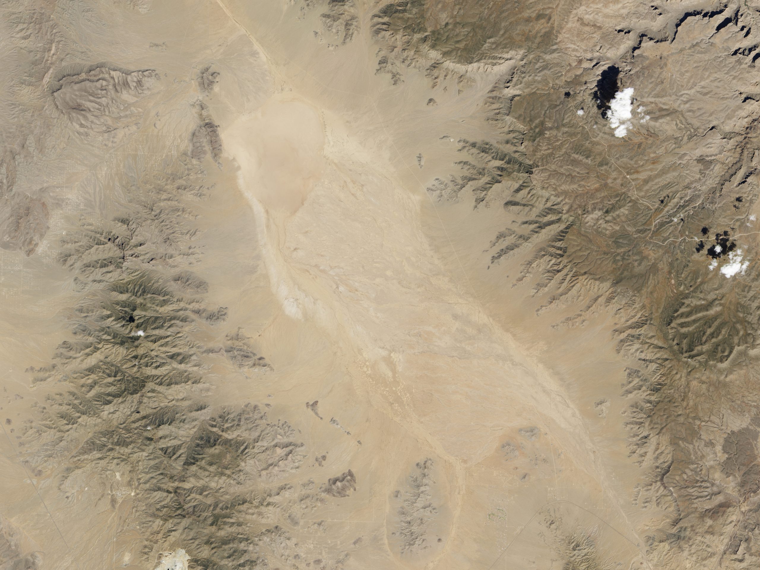 Satellite image from NASA. Satellite image of desert dry lake or playa surrounded by mountains.