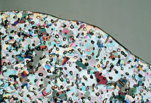 Source: Commonwealth Scientific and Industrial Research Organization (Australia) - https://en.wikipedia.org/wiki/File:CSIRO_ScienceImage_518_Air_Bubbles_Trapped_in_Ice.jpg Antarctic ice showing hundreds of tiny trapped air bubbles from the atmosphere thousands of years ago.
