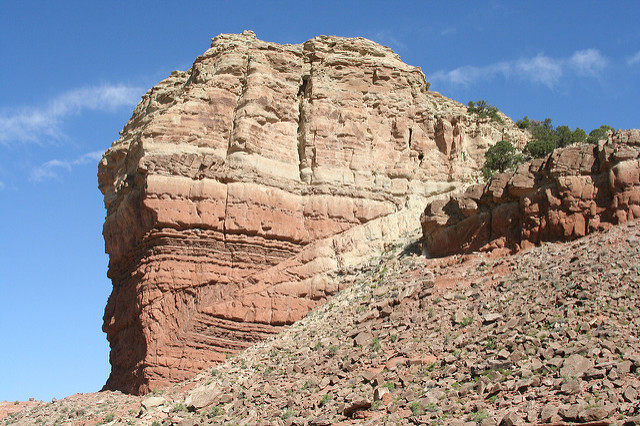 Beds of rock offset along a fault plane to where one section of the rock has been pushed up over itself.