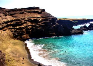 Hawiian beach composed of green olivine sand from weathering of nearby basaltic rock.