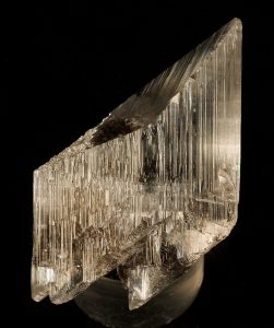 The mineral has many parallel lines on it