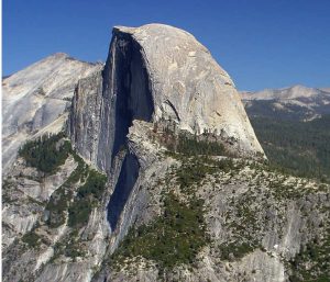 An intrusive igneous mass now exposed at the surface by erosion