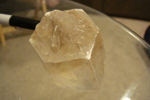 "By The mineral is hexagonal and clear.