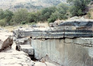 "By The rock has several layers, with the dark layers being the ones with value.
