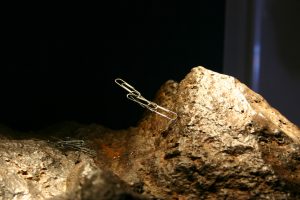 The paperclip is sticking up into the air.