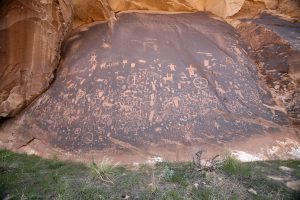 By Cacophony The rock is dark brown with petroglyphs