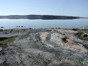 NASA, public domain It shows rocks on a shoreline.