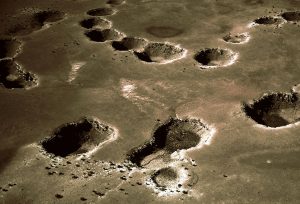 Sinkholes of the McCauley Sink in Northern Arizona, produced by collapse of Kaibab Limestone into caverns caused by solution of underlying salt deposits