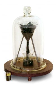 The setup is like an hourglass, and the black pitch sits in it