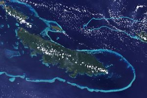 The reef is offshore of the island proper.