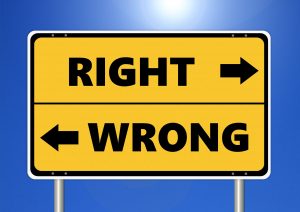 “ethics-2991600_1920” by Tumisu is licensed under CC0 1.0 Image showing a sign stating directions for right and wrong