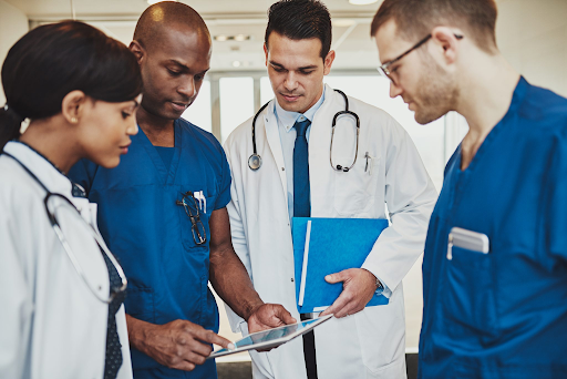 "400845937-huge.jpg" by Flamingo Images is used under license from Shutterstock.com Image showing a simulated interprofessional medical team discussing something