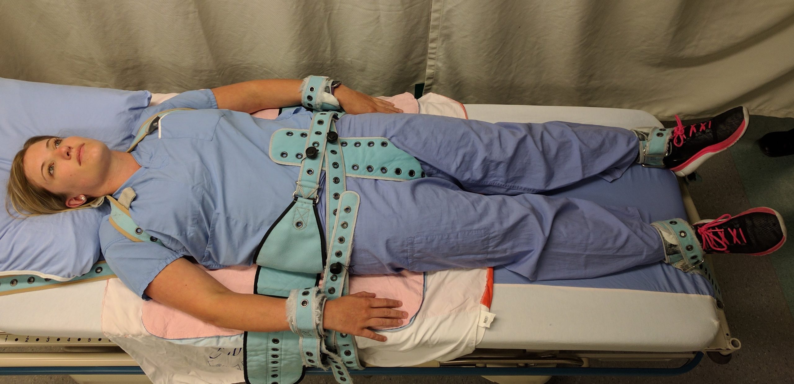 “PinelRestaint.jpg” by James Heilman, MD is licensed under CC BY-SA 4.0 Photo showing simulated patient in restraints