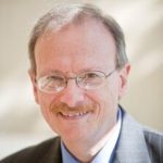 White male with glasses and moustache