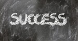 The word success on a blackboard