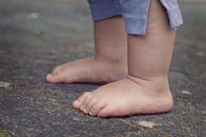 Tiny feet of a toddler