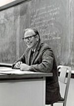 A picture of Robert Dahl sitting at a desk