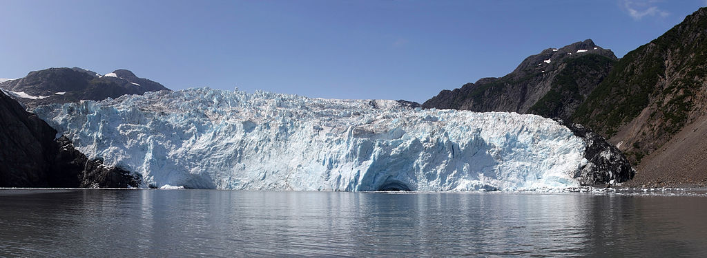 Photograph. When glaciers reach the sea they can break apart, depositing their sediments into the ocean, including very large pieces of rock