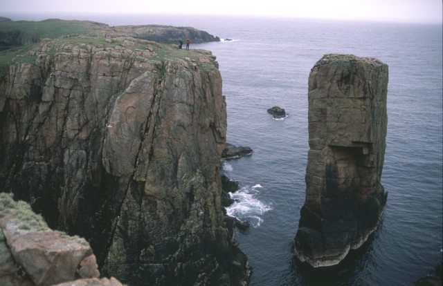 Image of a sea stack, likely created from the collapse of a sea arch.