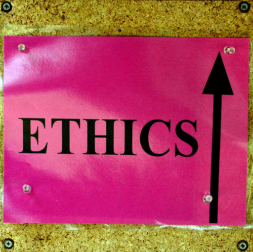 Sign reading "Ethics" with an arrow pointing up.