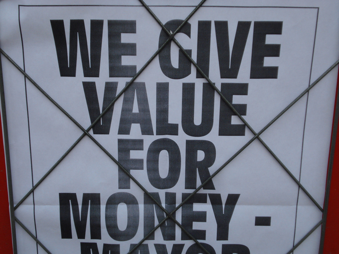 Sign reading "We give value for money - "