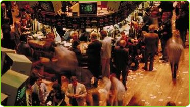 Photograph of the busy floor of the New York Stock Exchange during trading hours.