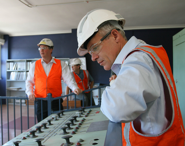 Image of workers inspecting equipment.