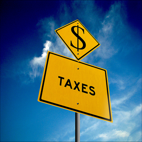 Street sign that reads taxes.