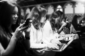 Journalists gather information at a pre-planned news event