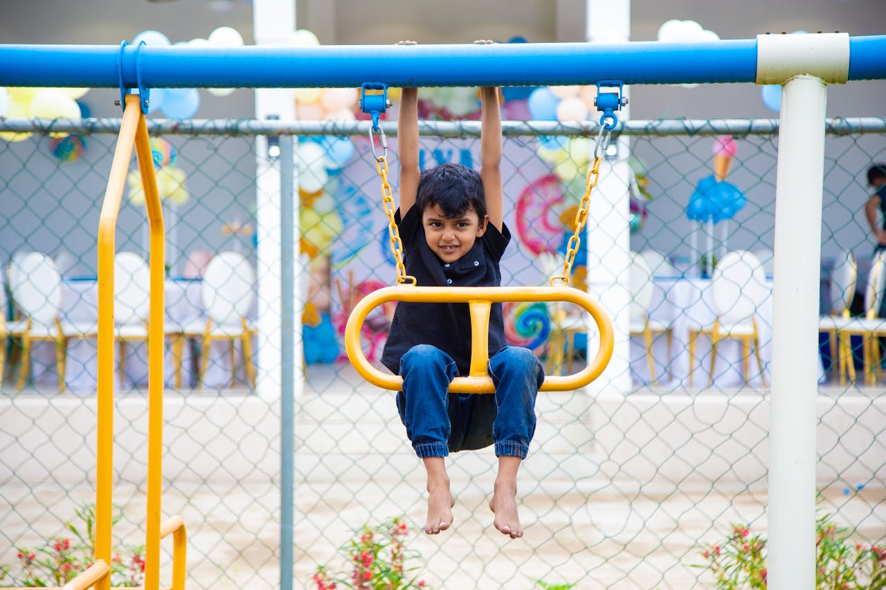Boy on swing set.