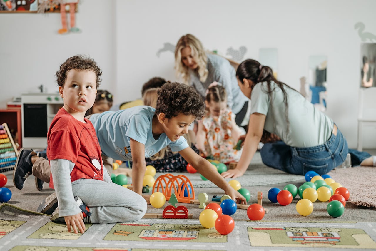 Children playing in preschool classroom.