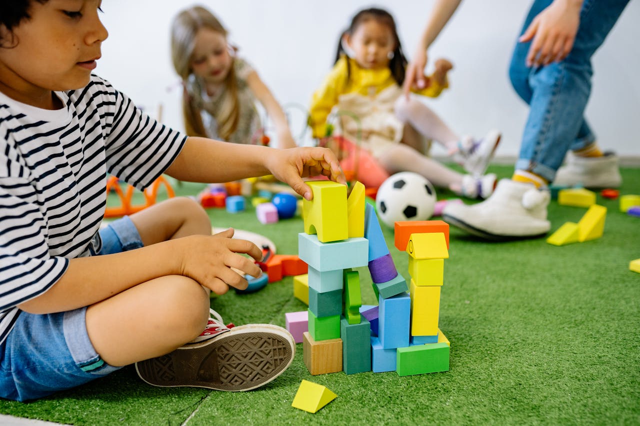 Children playing with blocks in preschool.