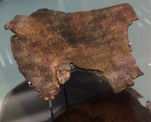 A second bronze sheet with words inscribed on it.