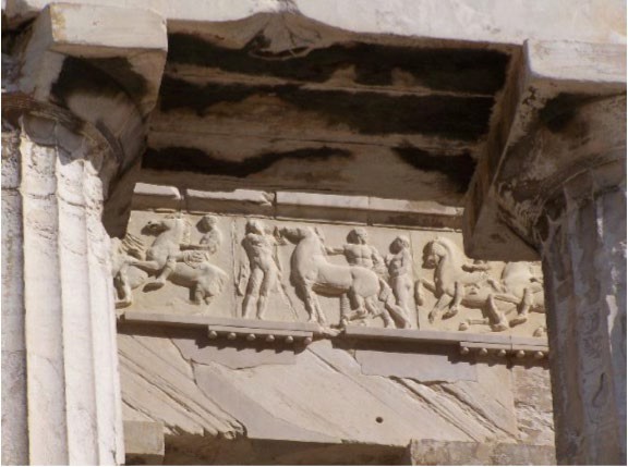 A photo of a cast of part of the Ionic Frieze. Horses and ideal, nude men are shown.