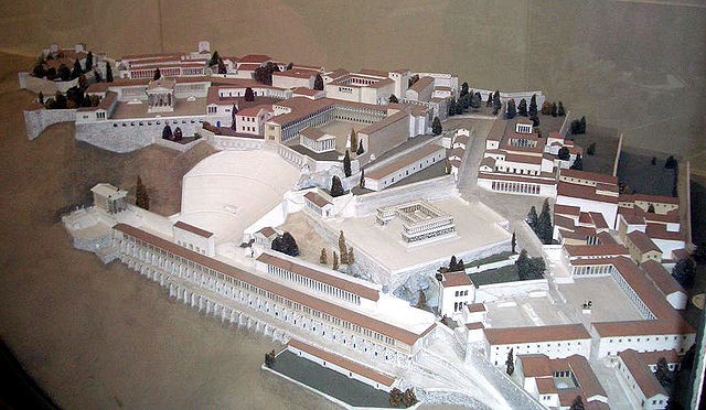 A scale model of a fabulous acropolis filled with buildings and roadways.