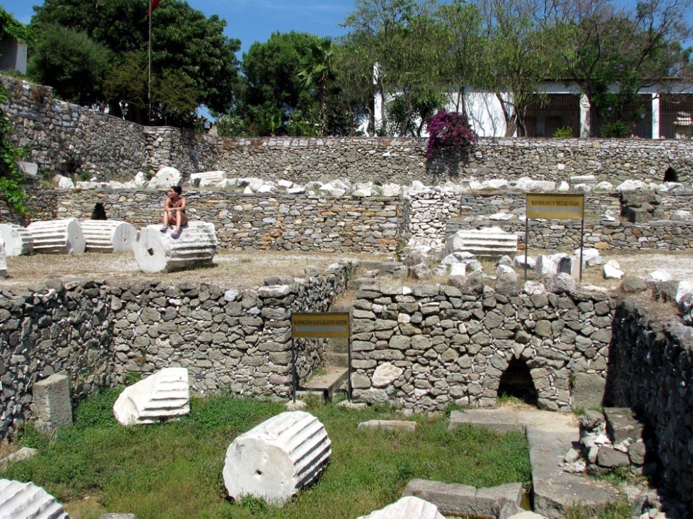 River stone foundations and while marble drums from fluted columns.