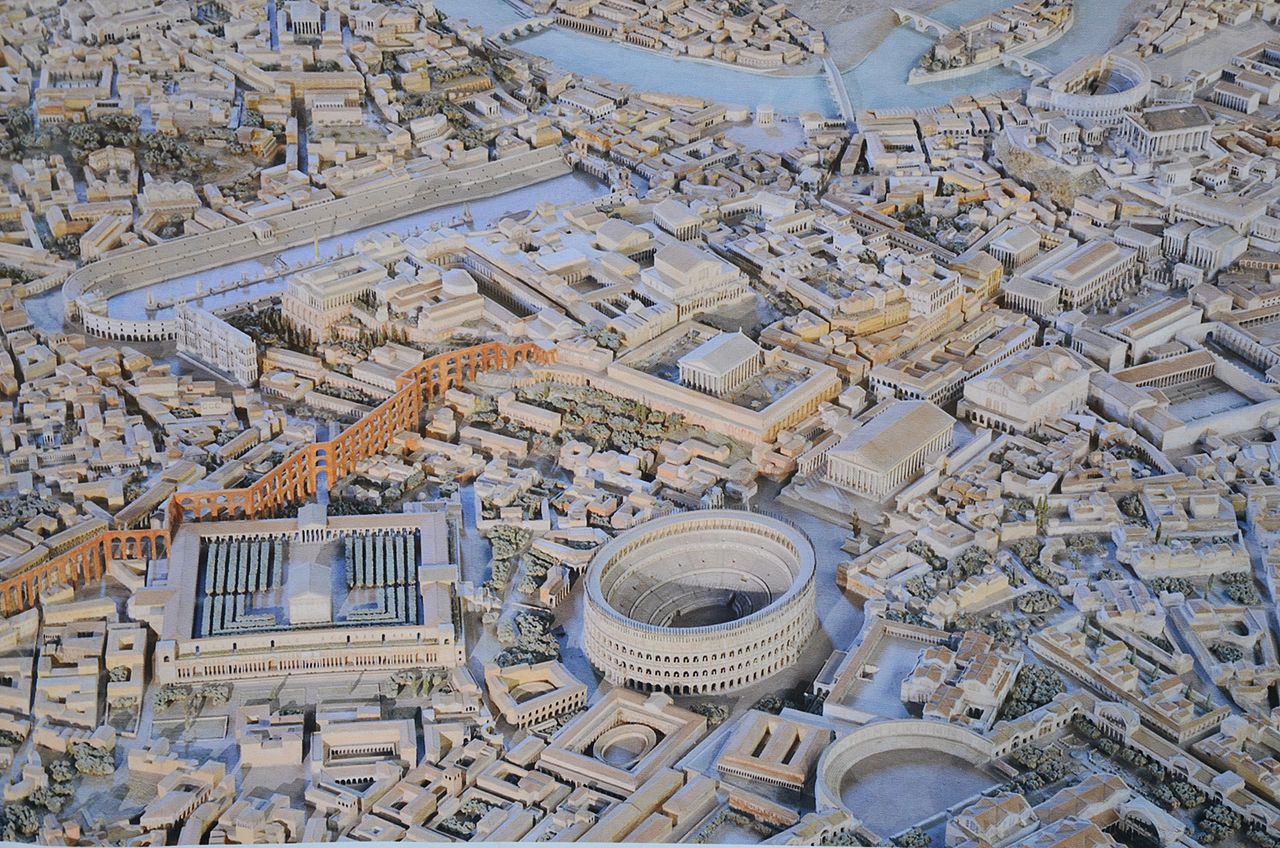 A bird’s-eye view of a model of the City of Rome. It is a sprawling city of roads, aqueducts, public and private buildings tied together by the Tiber River.