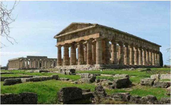 A large Doric temple with a peaked stone roof and pillars all around to hold it up. Remains of the interior room are still visible.