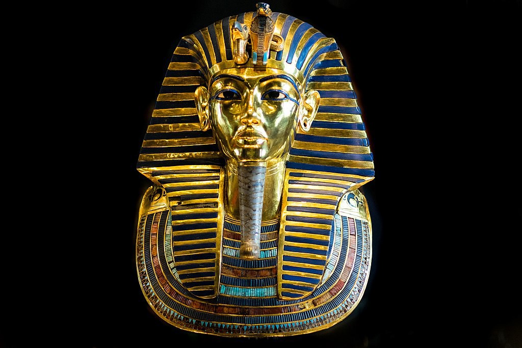 The golden mask of Tutankhamen. It is decorated with coral and lapis lazuli and presents an ideal image of the young king in the pre-Akhenaten tradition.