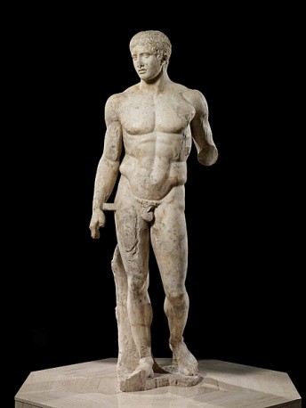 A muscular nude man stepping forward.