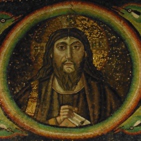 A bearded Christ bust in a circular mosaic.