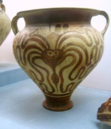 A highly stylized octopus painted on a large pot.