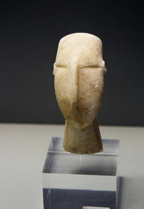 Stone carving of an ancient face. It resembles the modern one in image 4.15.