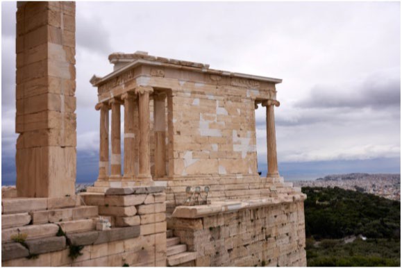 A photo of Athena’s Nike Temple. It sits on a precipice overlooking the walkway that winds up the acropolis.