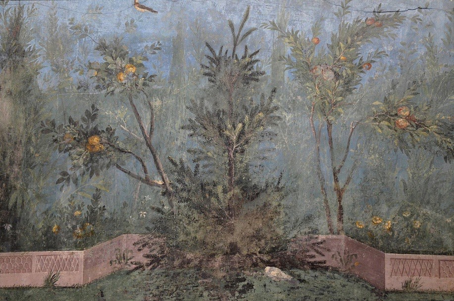 A wall fresco of a garden with an orange tree and a short wall around it. Flowers can be seen beyond the wall.